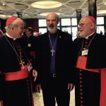 Laughing with the presidents of the German and Austrian Bishops Conference, Cardinal Marx and Cardinal Schönborn, Munich and Vienna, in the hall of the synod building of the Vatican (2015)