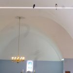 A pair of swallows fly up and down in a church service on the North Sea islands Batrum (2014)