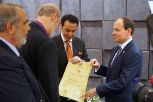 The Albanian President receiving the life membership of the Royal Academy from Thomas Schirrmacher, with HIRH Prince Gharios El Chemor of Ghassan Al-Numan VIII and Sheikh Selim El Chemor.