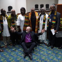 Best protection possible: Under the blessing of African bishops, pastors and friends at the Global Christian Forum in Bogota, Columbia. In the middle the new secretary of the GCF, Casely Essamuah from Ghana, with his wife.
